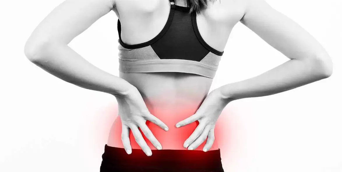 Pain in the lumbar region, which can be alleviated by exercises and correct body position